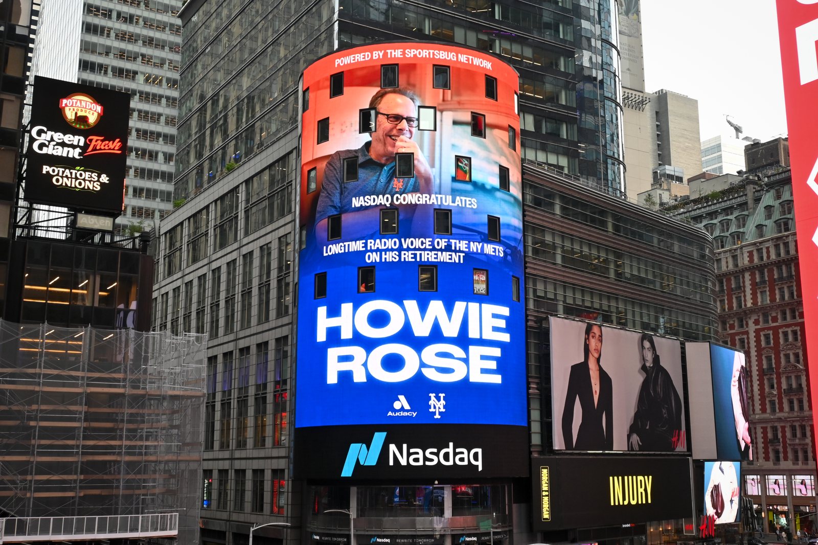 The NASDAQ tower in Times Square: NASDAQ congratulates Howie Rose, powered by the SportsBug Network.